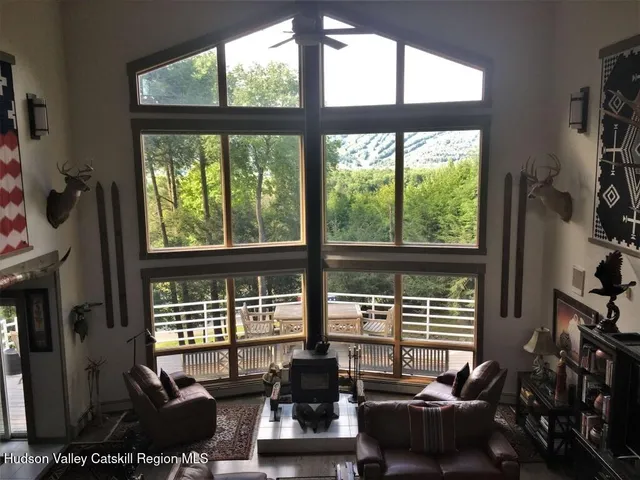 a room with furniture and large windows