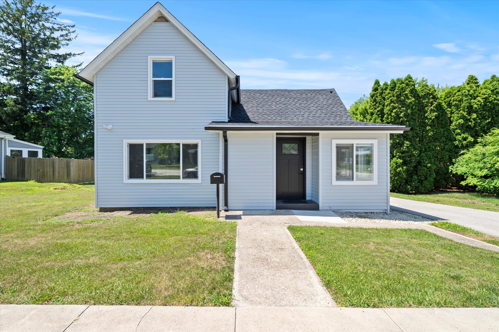 219 South Washington Street Lockport, IL 60441 - Photo 1 of 24 a view of a house with a yard and potted plants