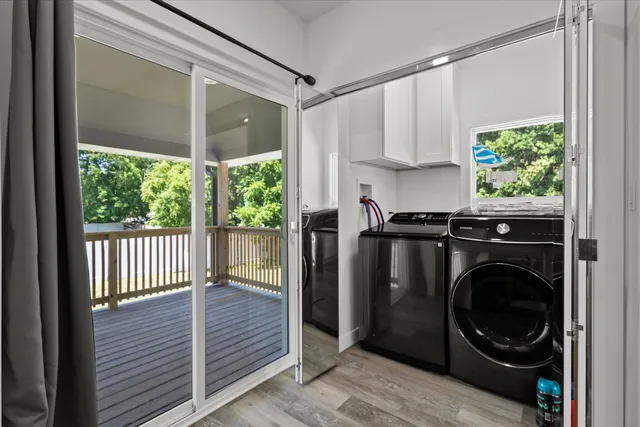 a close view of a utility room with washer and dryer