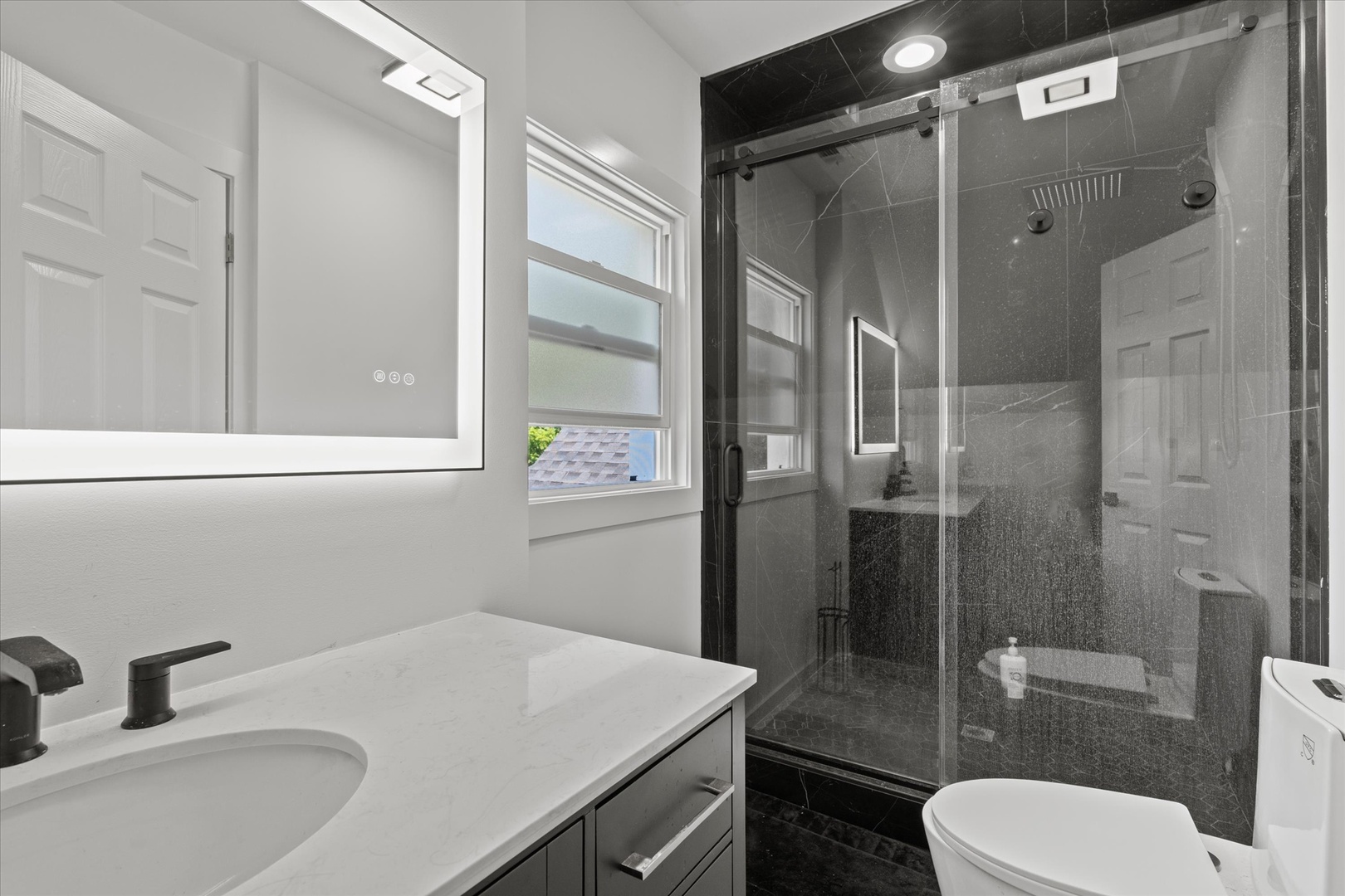 219 South Washington Street Lockport, IL 60441 - Photo 12 of 24 a bathroom with a sink toilet and shower