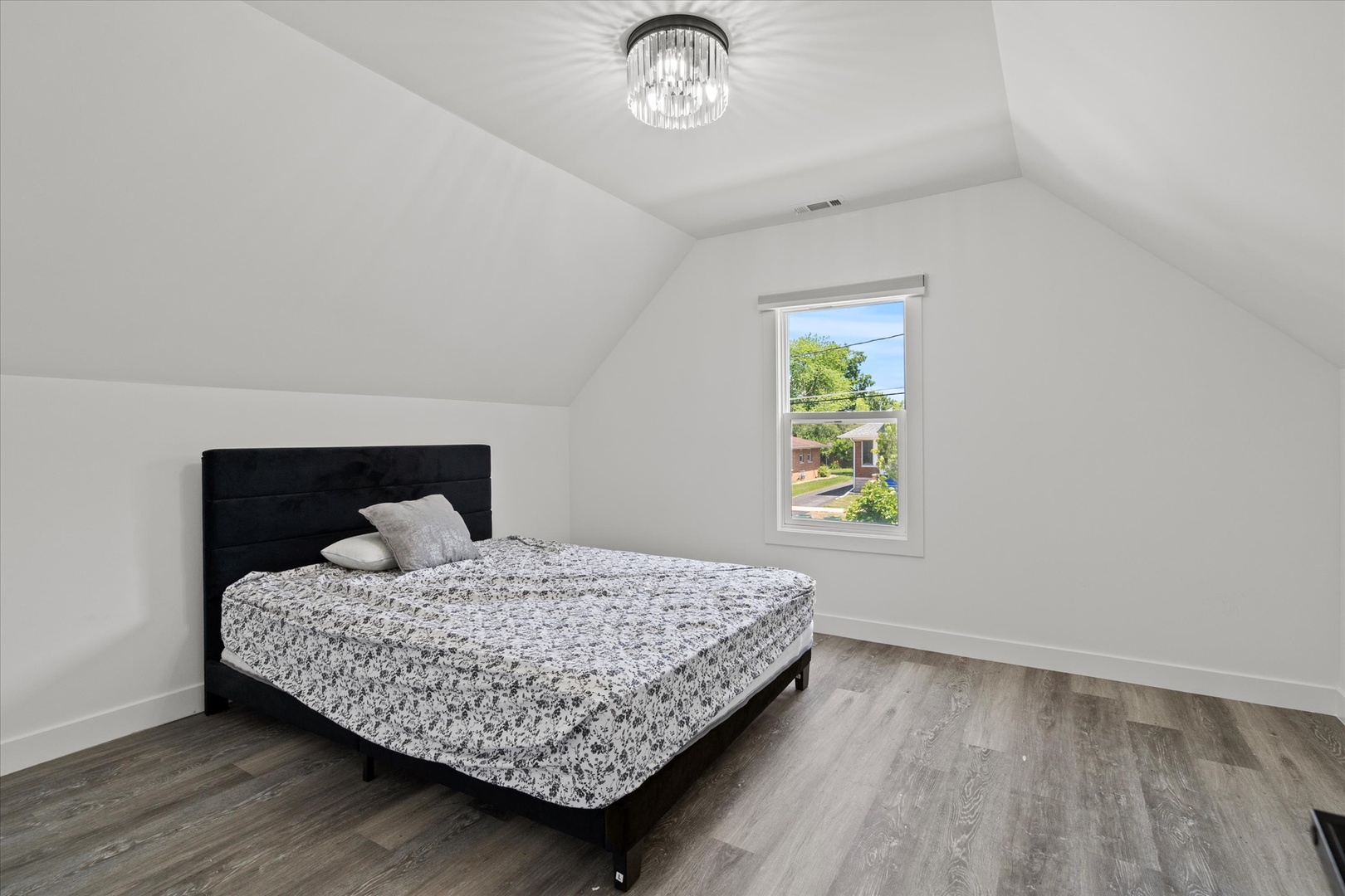 219 South Washington Street Lockport, IL 60441 - Photo 13 of 24 a bedroom with a bed and a window