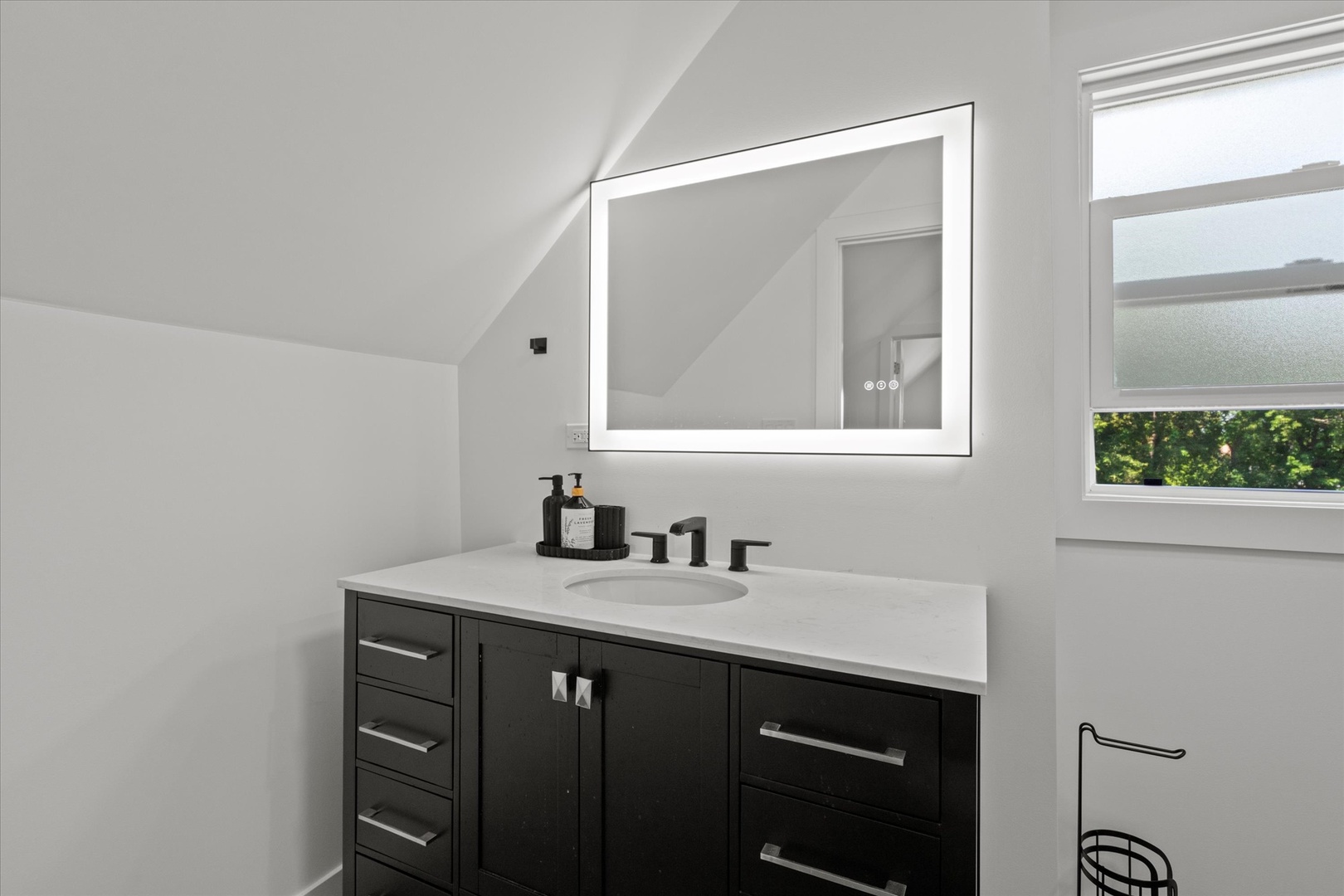 219 South Washington Street Lockport, IL 60441 - Photo 14 of 24 a bathroom with a sink and a mirror