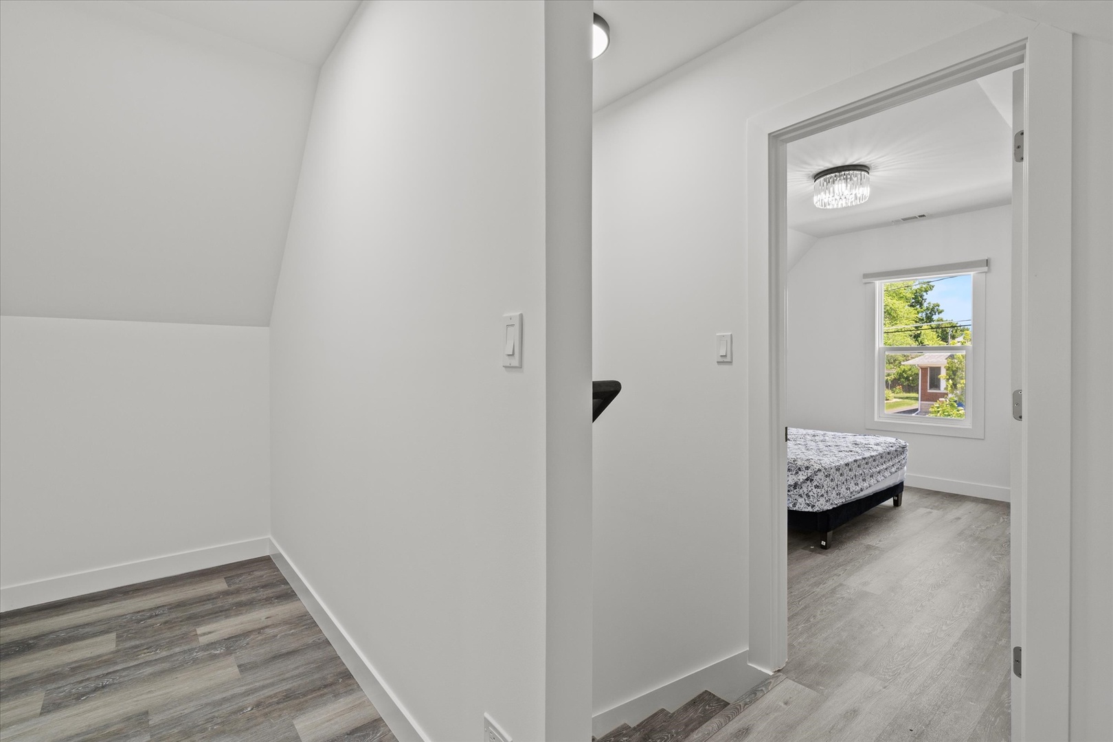 219 South Washington Street Lockport, IL 60441 - Photo 15 of 24 a view of a hallway with wooden floor and a bedroom