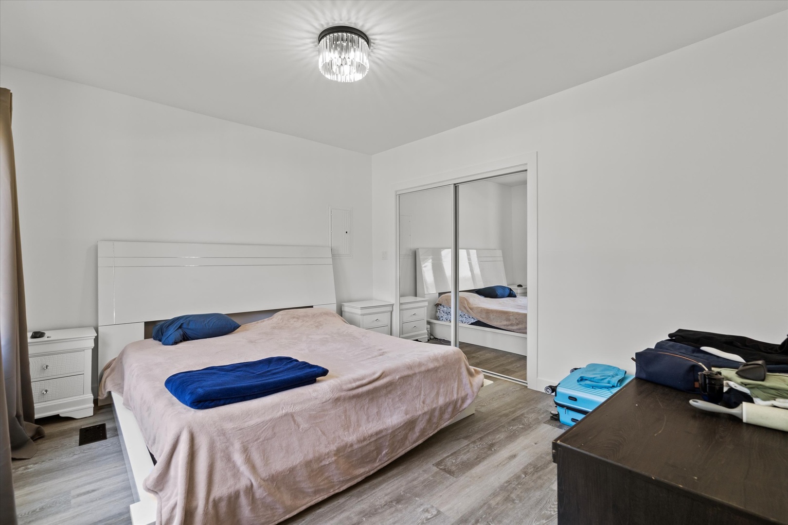 219 South Washington Street Lockport, IL 60441 - Photo 16 of 24 a bedroom with a bed and a chandelier