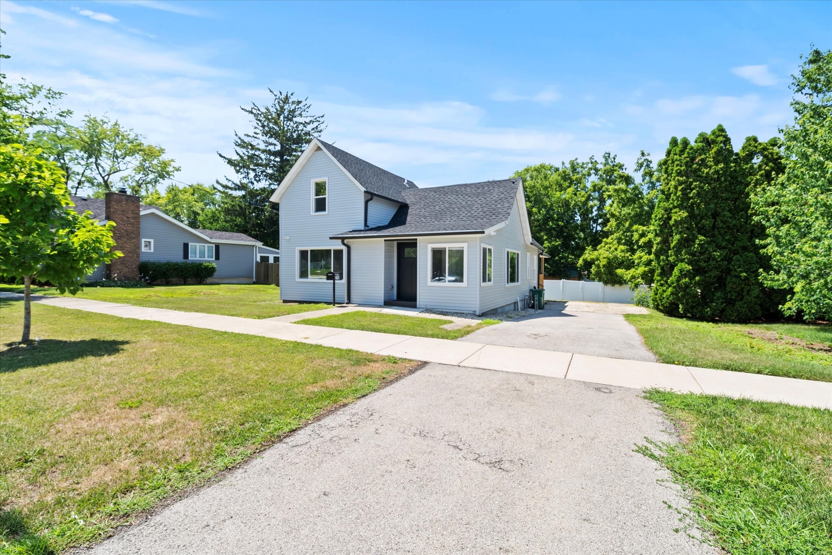 219 South Washington Street Lockport, IL 60441 - Photo 2 of 24 a house view with swimming pool in front of it