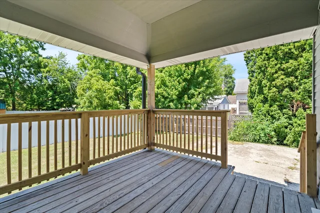 a view of balcony with wooden floor
