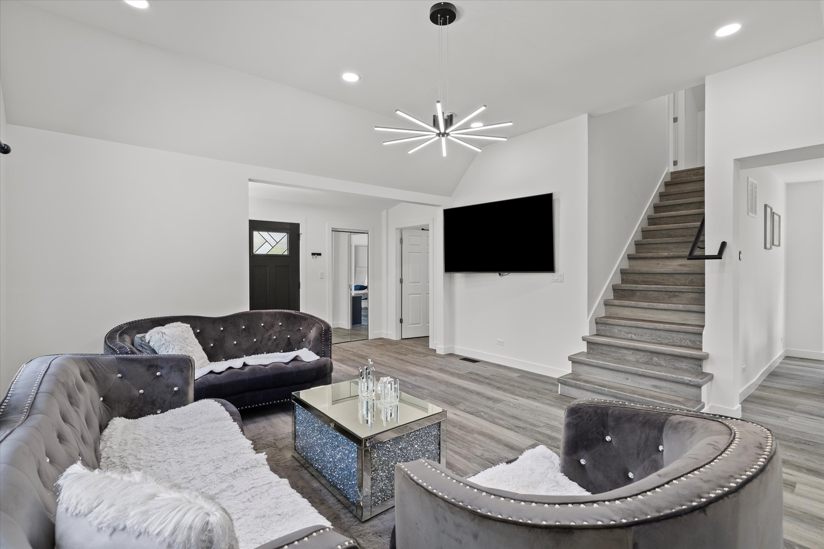 219 South Washington Street Lockport, IL 60441 - Photo 5 of 24 a living room with furniture and a flat screen tv