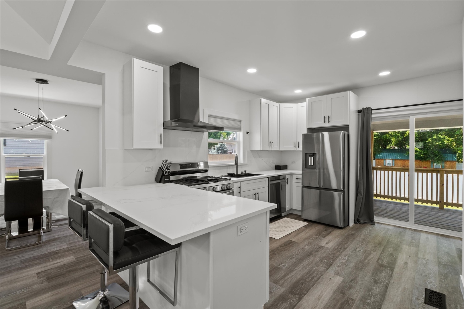 219 South Washington Street Lockport, IL 60441 - Photo 8 of 24 a kitchen with refrigerator cabinets and wooden floor