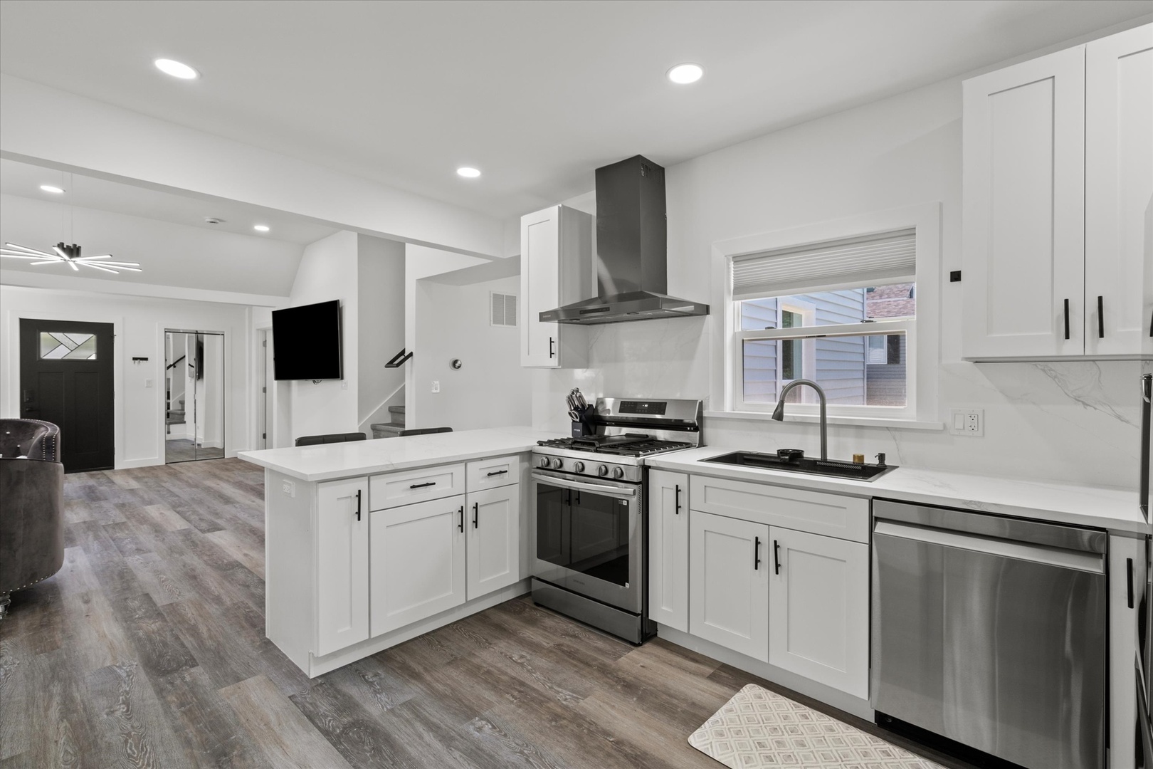 219 South Washington Street Lockport, IL 60441 - Photo 9 of 24 a kitchen with stainless steel appliances granite countertop a sink and stove top oven