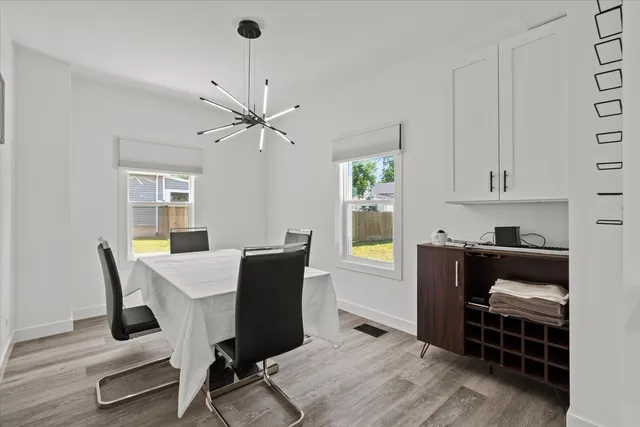 a workspace with furniture window and wooden floor