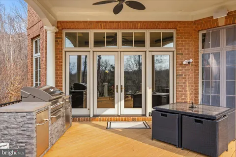 a living room with furniture and large windows