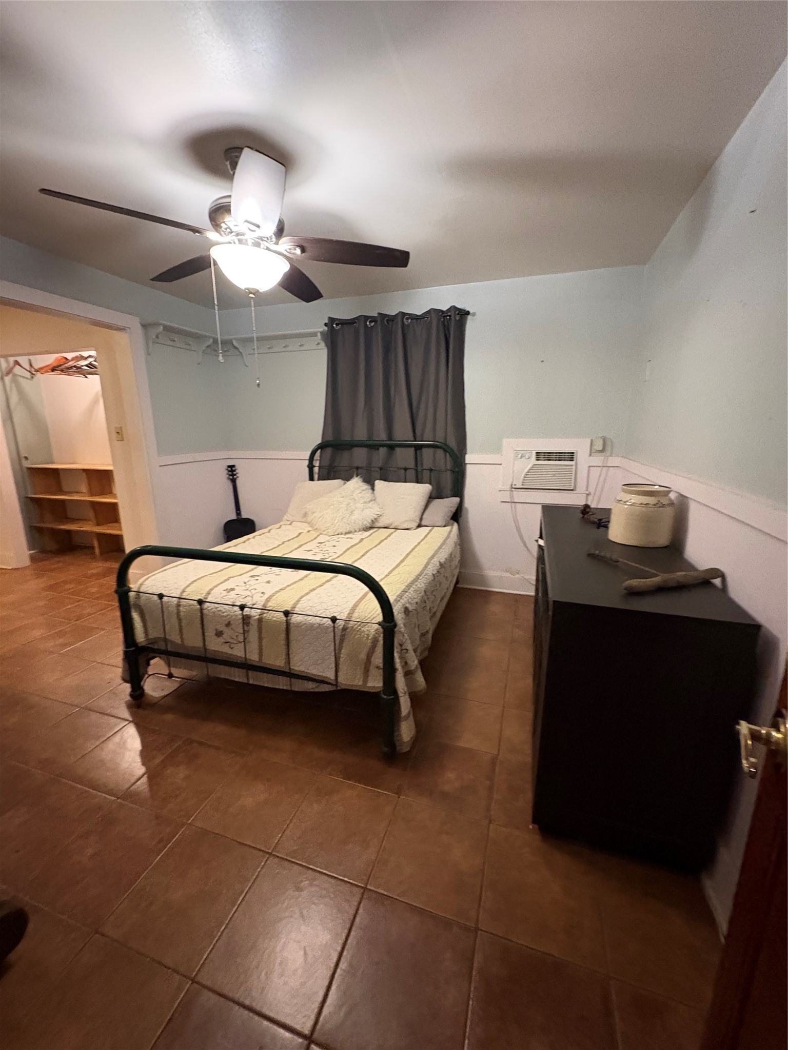 550 Dogwood Road Cleveland, TX 77328 - Photo 19 of 49 a bedroom with a bed and a chandelier