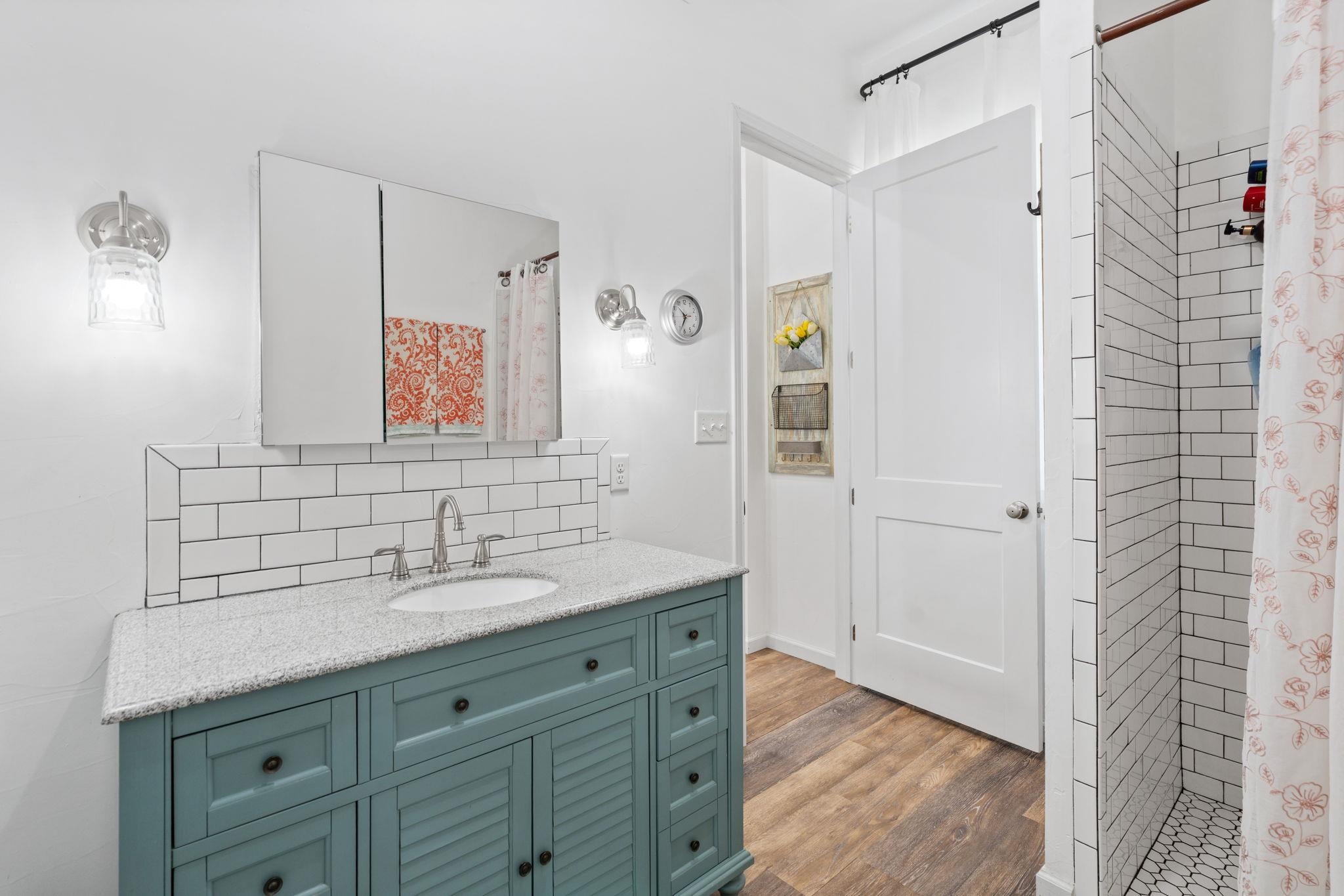 452 Southwick Ranch Road Johnson City, TX 78636 - Photo 40 of 44 a bathroom with a sink and a mirror