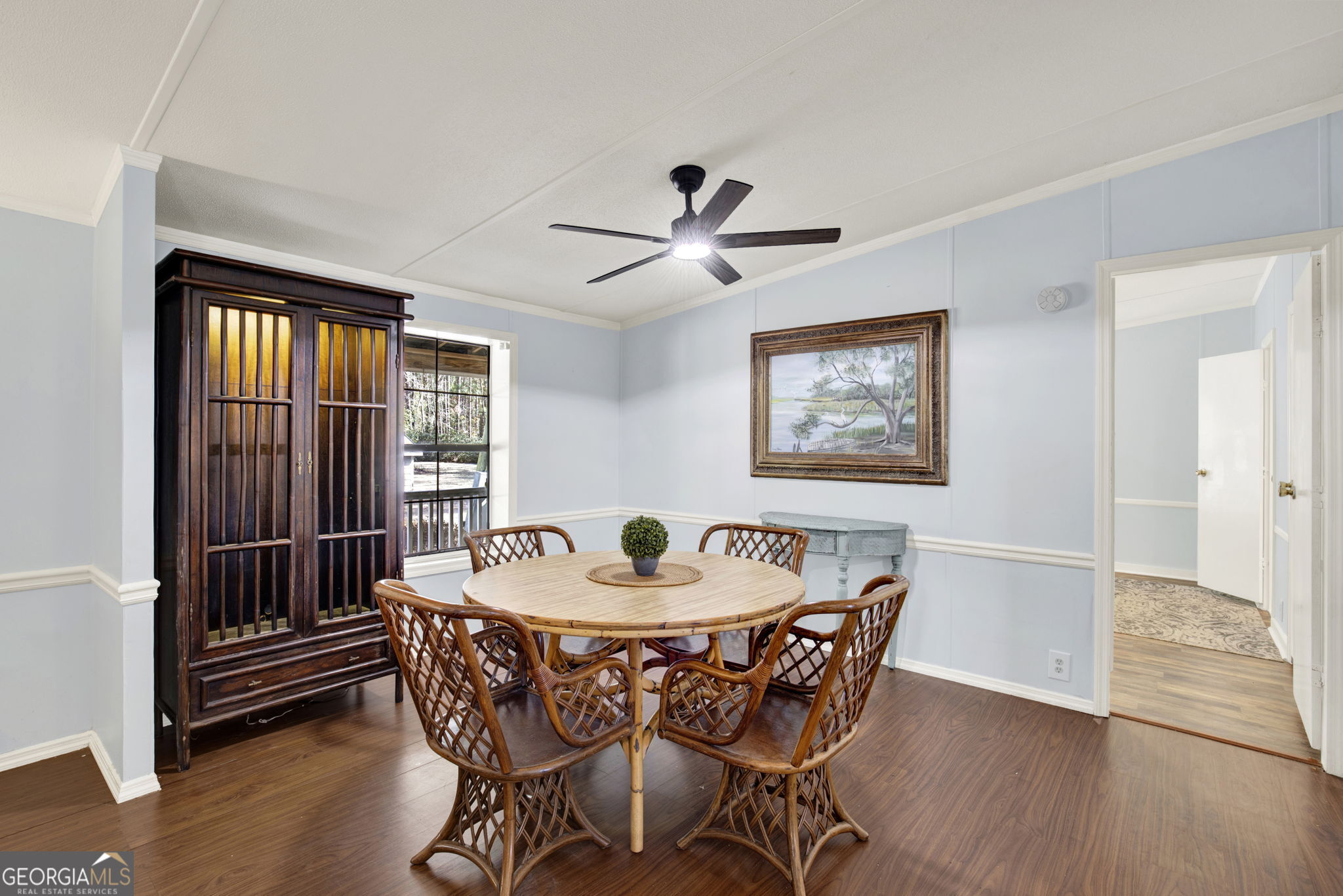 1262 Doodle Hill Road Northeast Townsend, GA 31331 - Photo 12 of 44 a dining room with furniture a chandelier and wooden floor