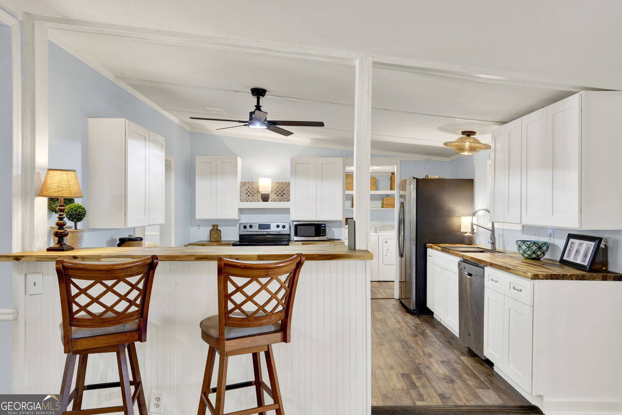 1262 Doodle Hill Road Northeast Townsend, GA 31331 - Photo 14 of 44 a kitchen with stainless steel appliances granite countertop a stove a sink a refrigerator and a refrigerator