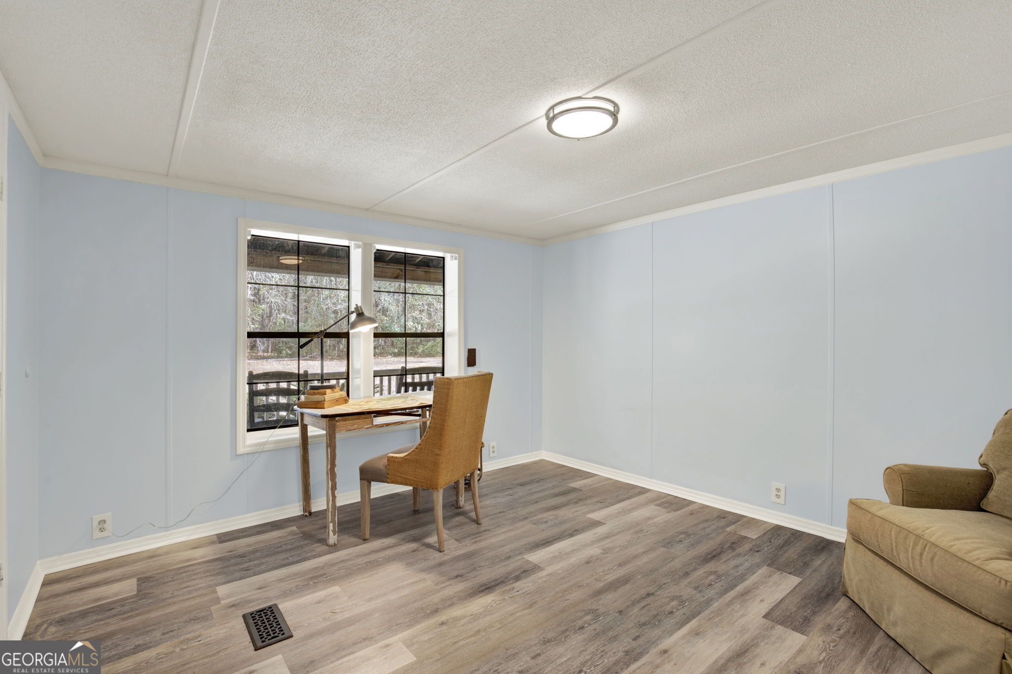 1262 Doodle Hill Road Northeast Townsend, GA 31331 - Photo 22 of 44 a workspace with furniture wall paintings and a window