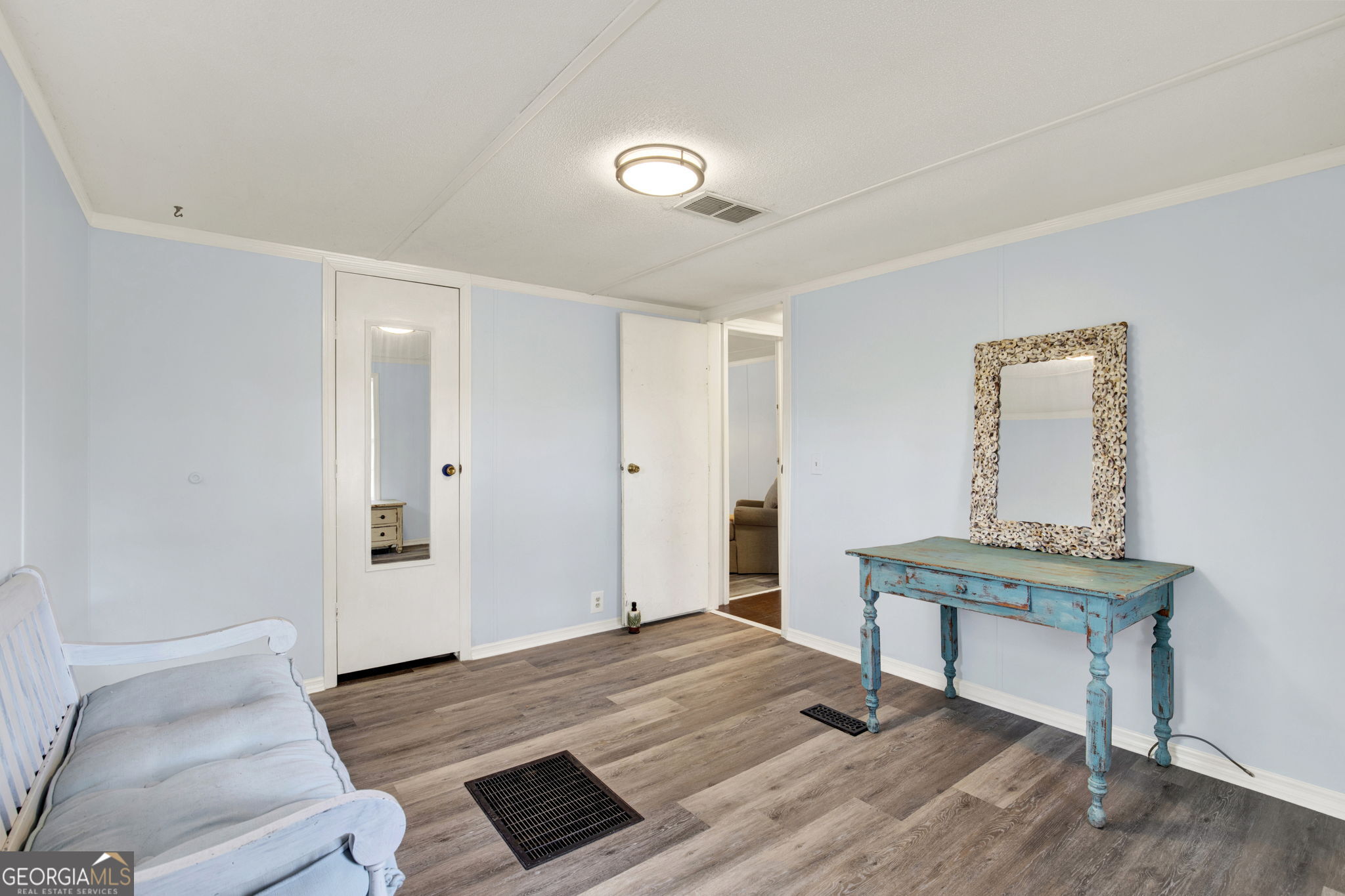 1262 Doodle Hill Road Northeast Townsend, GA 31331 - Photo 25 of 44 a view of a livingroom with wooden floor and furniture