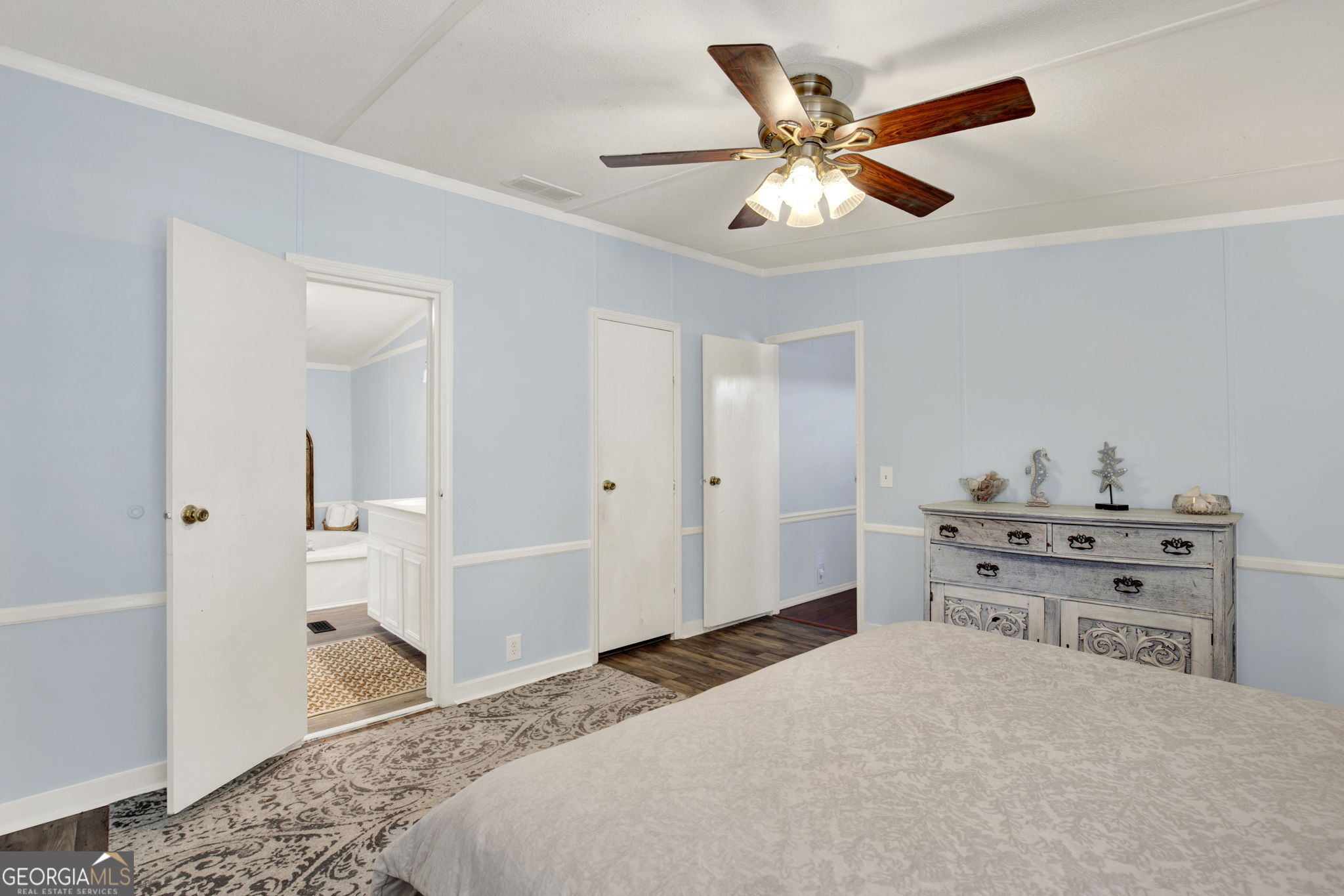 1262 Doodle Hill Road Northeast Townsend, GA 31331 - Photo 27 of 44 a bedroom with a bed and a dresser