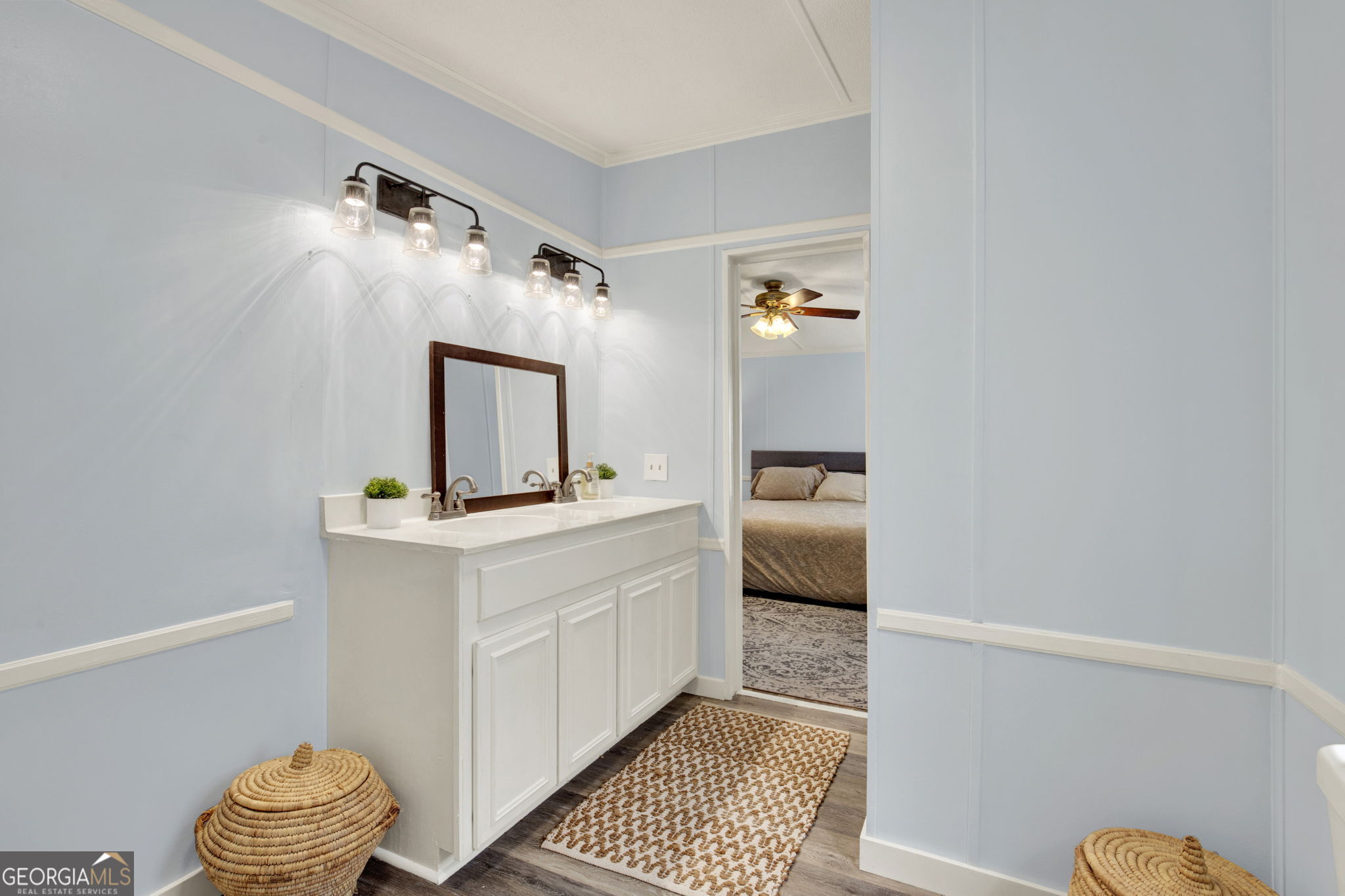 1262 Doodle Hill Road Northeast Townsend, GA 31331 - Photo 30 of 44 a bathroom with a sink a toilet and mirror