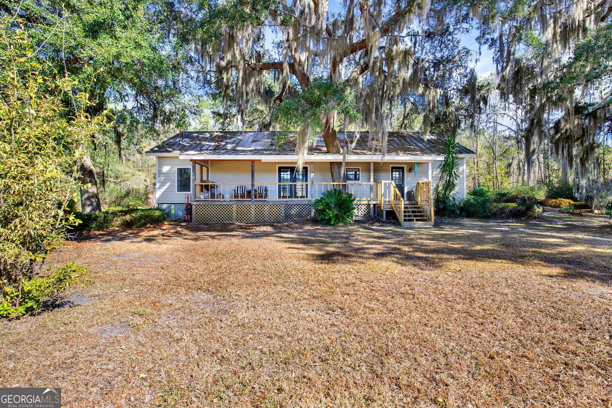 1262 Doodle Hill Road Northeast Townsend, GA 31331 - Photo 34 of 44 front view of a house with a tree in front of it