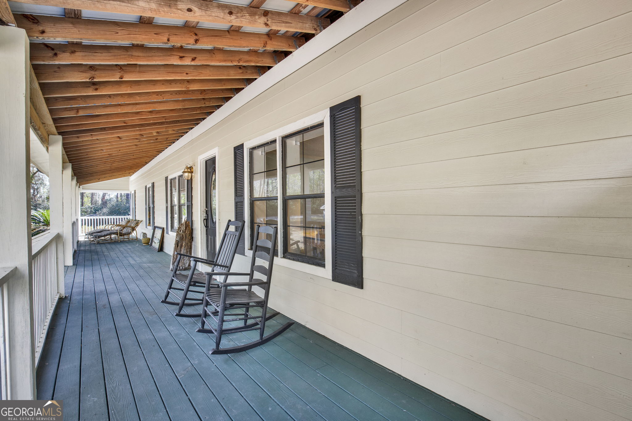 1262 Doodle Hill Road Northeast Townsend, GA 31331 - Photo 5 of 44 a view of a chairs and table on the wooden floor
