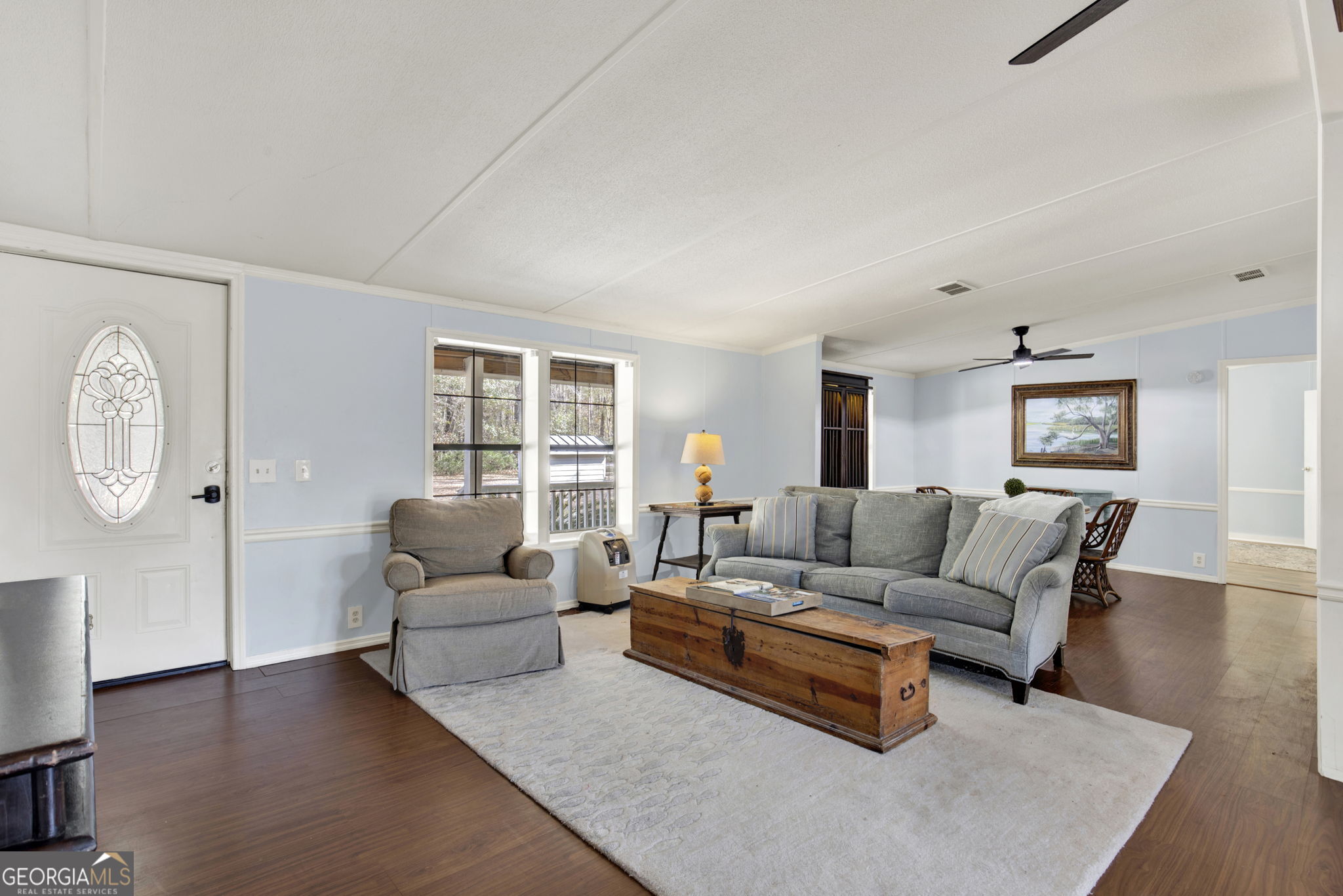 1262 Doodle Hill Road Northeast Townsend, GA 31331 - Photo 7 of 44 a living room with furniture and a wooden floor