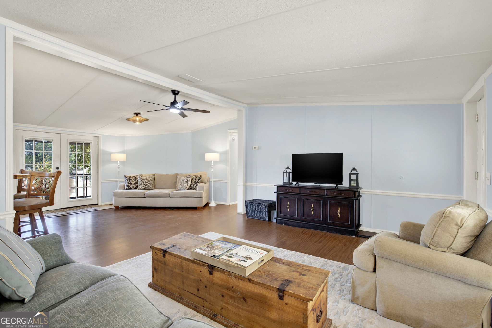 1262 Doodle Hill Road Northeast Townsend, GA 31331 - Photo 8 of 44 a living room with furniture and a flat screen tv