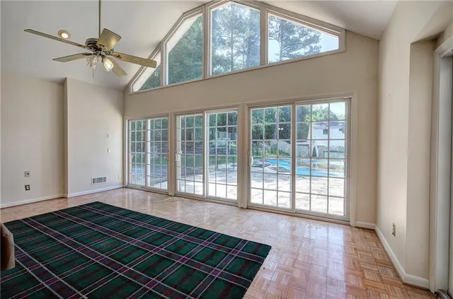 a view of an empty room with a window