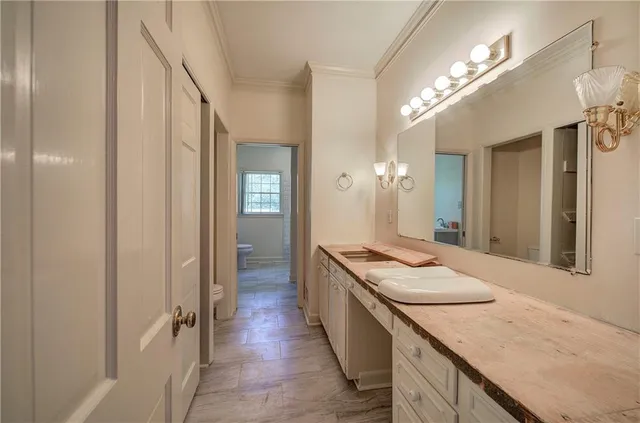 a bathroom with sink granite and mirror
