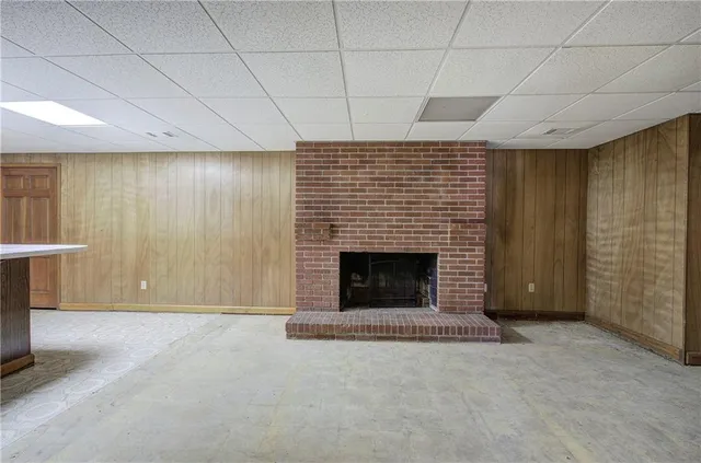 a view of an empty room with a fireplace