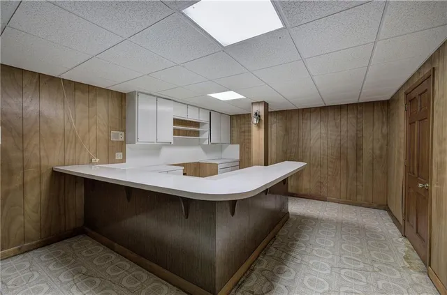 a kitchen with stainless steel appliances a sink dishwasher and stove