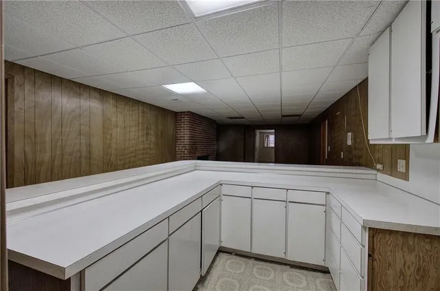 a kitchen with a cabinets and chandelier