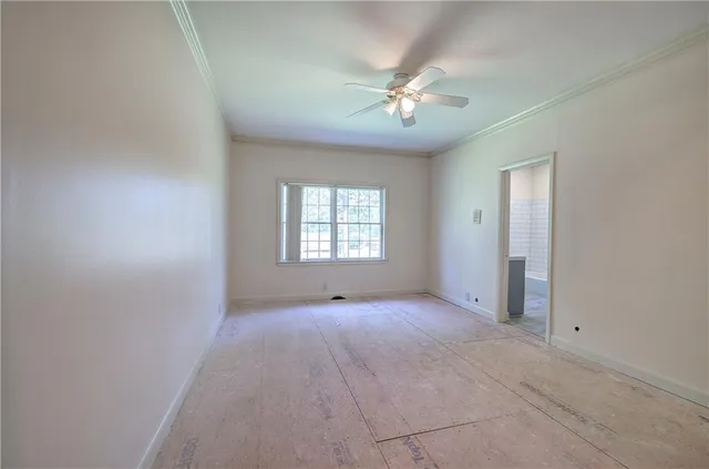 en empty room with closet and wooden door