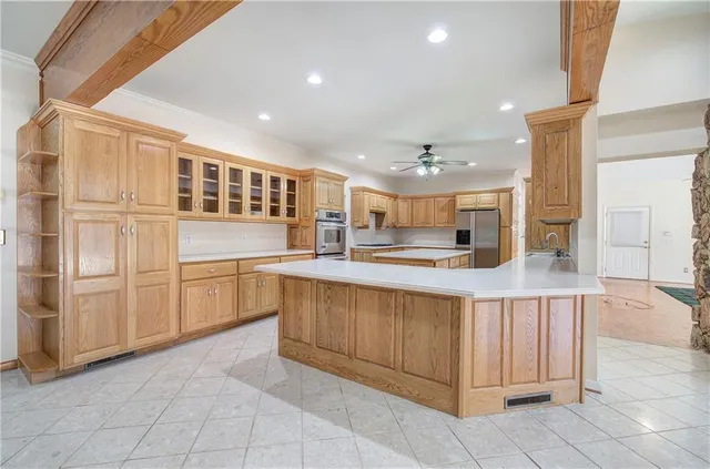 a kitchen with stainless steel appliances granite countertop a sink and cabinets