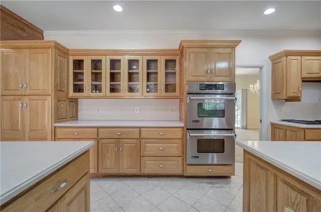 a kitchen with a stove oven and sink