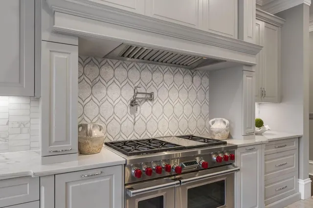 a living room with furniture large window and a fireplace
