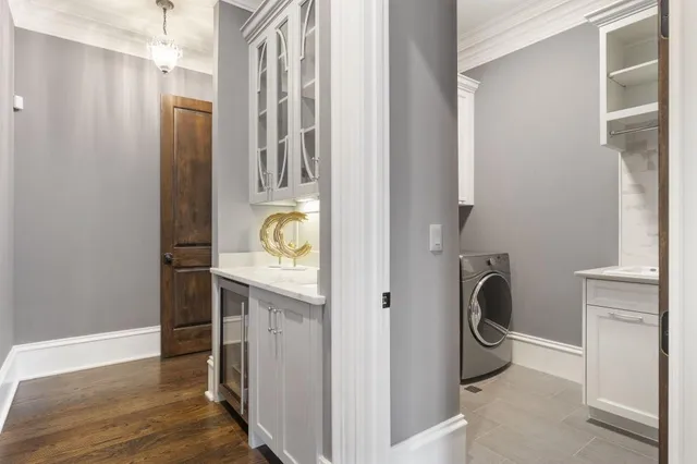 a bathroom with a double vanity sink a mirror and a bathtub