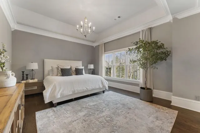 a bathroom with a granite countertop sink mirror and a shower