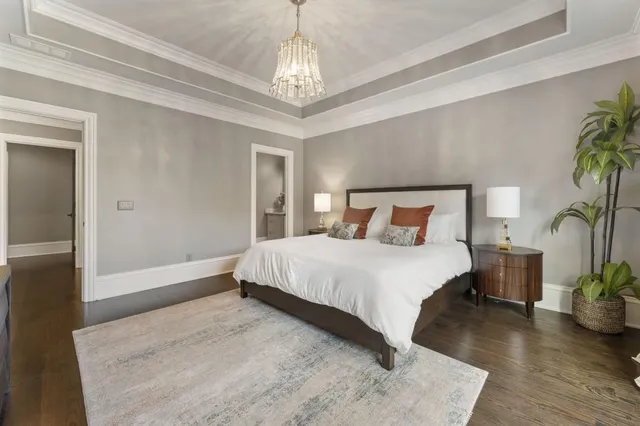 a view of a kitchen with kitchen island stainless steel appliances counter space