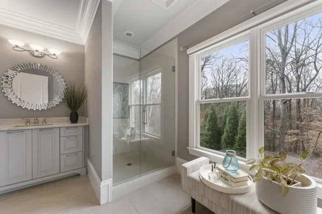 a room with pool table flat screen tv and windows