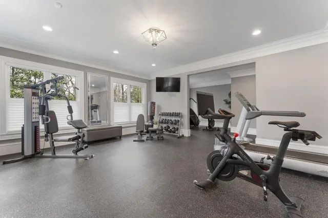 a view of a patio with table and chairs and potted plants