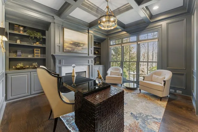 a bathroom with a granite countertop sink a mirror and vanity