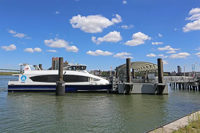 a view of a lake with couches chairs