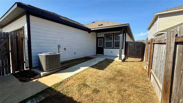 a side view of a house with a garage
