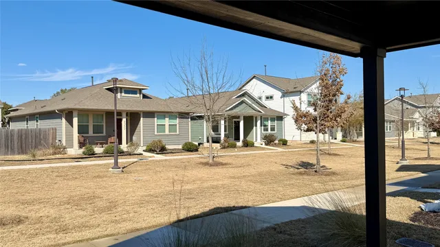 a swimming pool with outdoor seating and yard