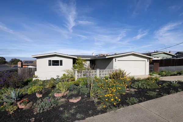 a house with trees in front of it
