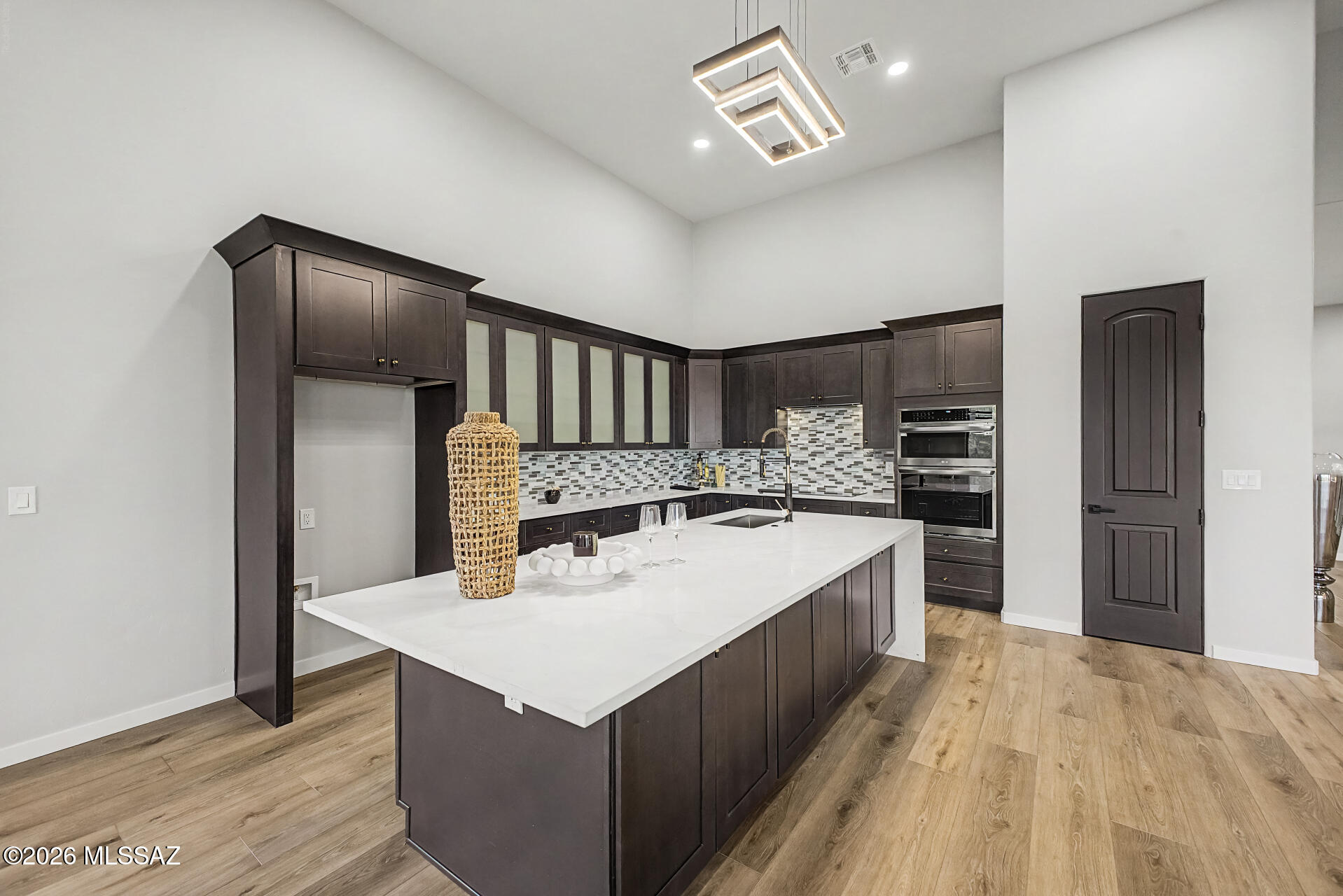 2399 Della Roccia Court Tucson, AZ 85737 - Photo 10 of 34 a kitchen with a stove refrigerator and cabinets