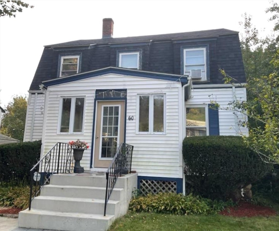 60 Bradlee Street Boston, MA 02136 - Photo 2 of 12 a front view of a house with a yard