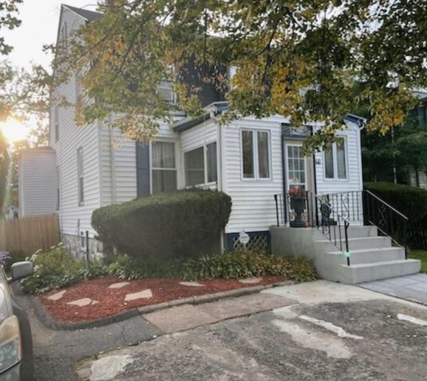 60 Bradlee Street Boston, MA 02136 - Photo 3 of 12 a front view of a house with a yard