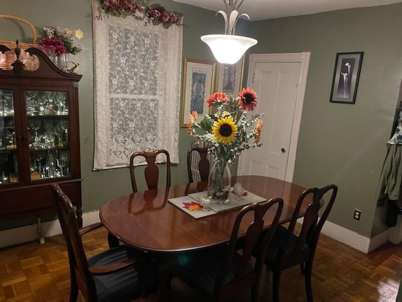 60 Bradlee Street Boston, MA 02136 - Photo 9 of 12 a view of a dining room with furniture and chandelier